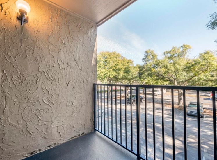 Private balcony overlooking parking lot